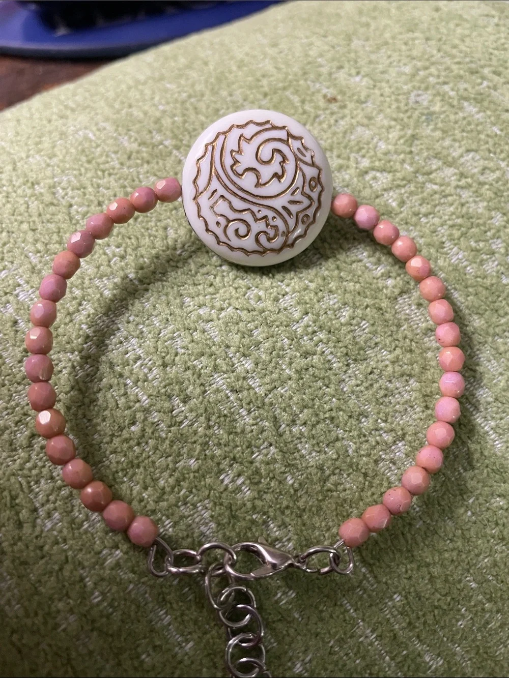 Clay Colored Beaded Bracelet with Off- White Gold-Trimmed Plastic Medallion